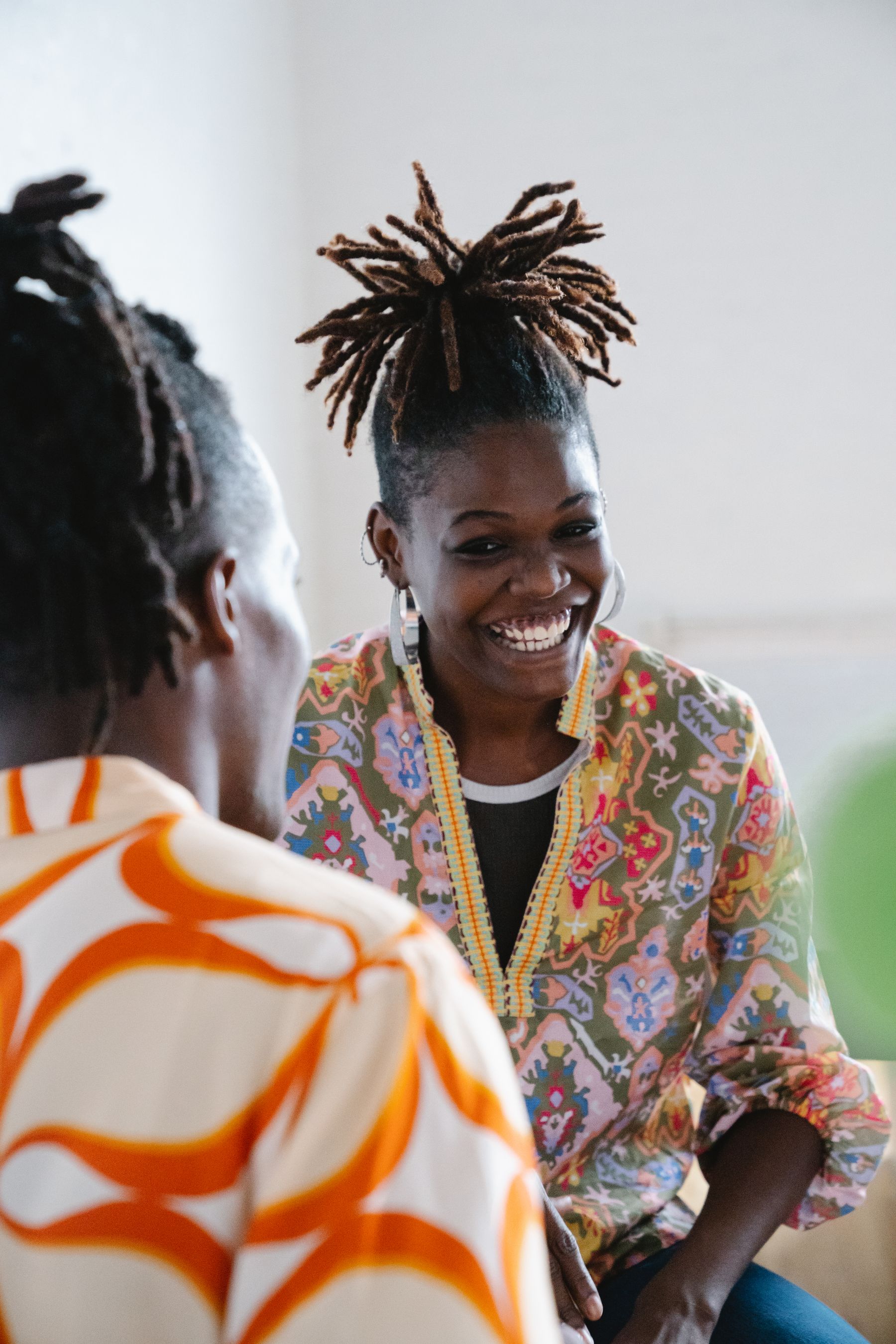 Two people enjoying a warm conversation